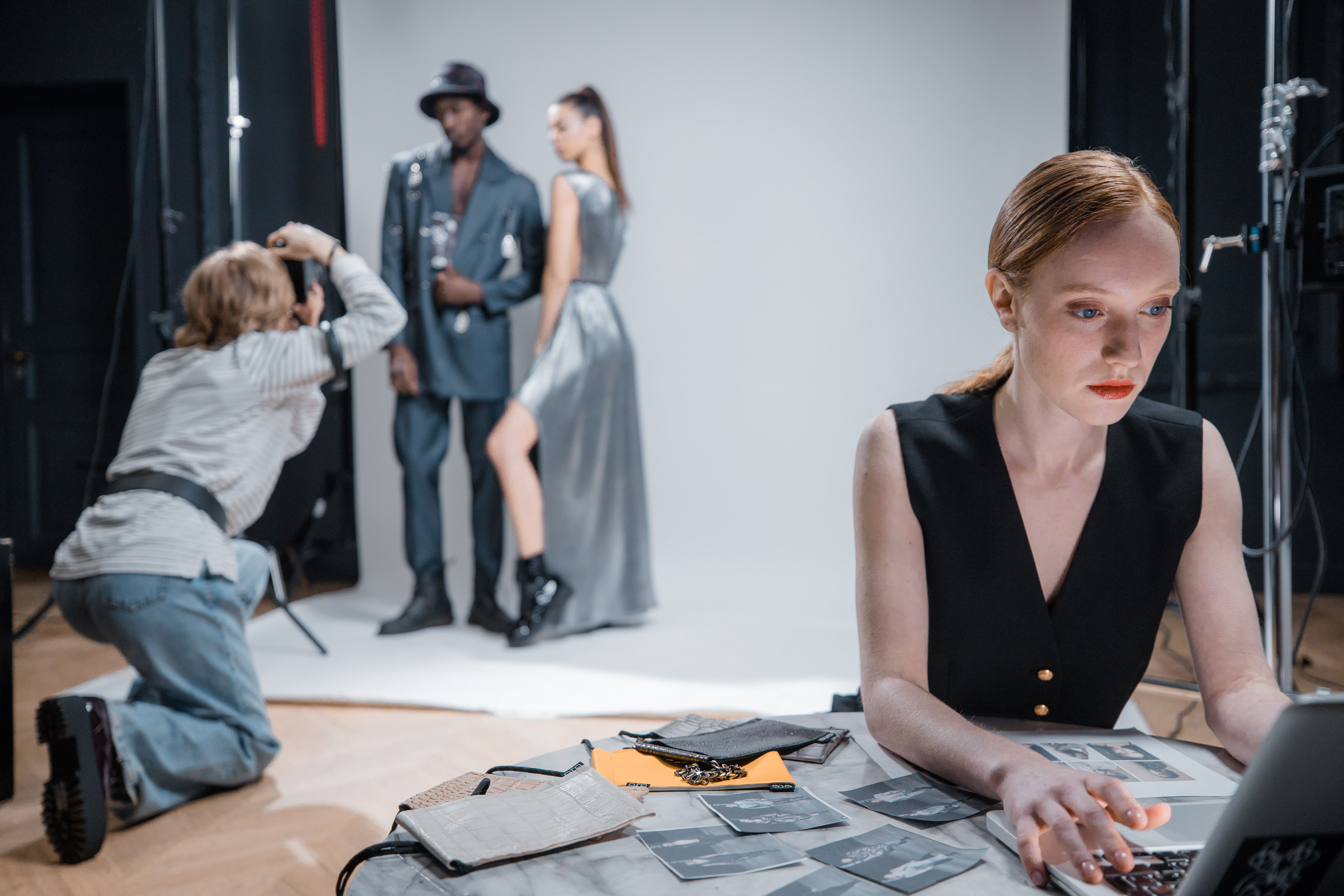 Photographer capturing fashion models during a professional casting photoshoot in a studio